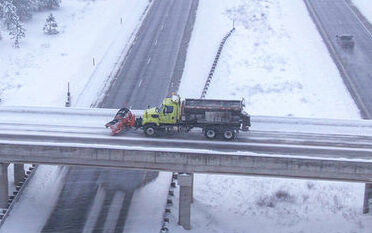 snow plow on overpass